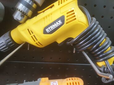 электрокачели для новорожденных: Желтая электрическая дрель RTRMAX. Имеет патрон для сверл, удобный для