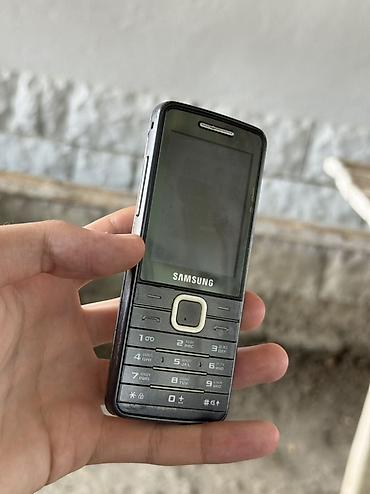 kontakt iphone 15 pro: Samsung S5610, rəng - Qara, Düyməli — 3