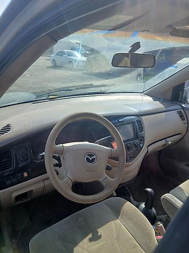 avtomobil salonu: Mazda miniven salonu – orijinal hissələr - Sükan: Mazda loqolu, hava — 1