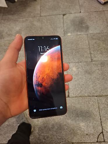 nokia asha 305: Redmi smartfon – narıncı rəngli korpus, arxa paneldə teksturalı səth — 3