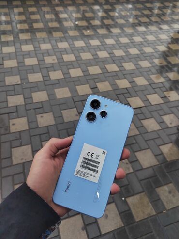 телефон fly bl9205: Xiaomi Redmi 12, 256 ГБ, цвет - Голубой, 
 Кнопочный, Отпечаток пальца