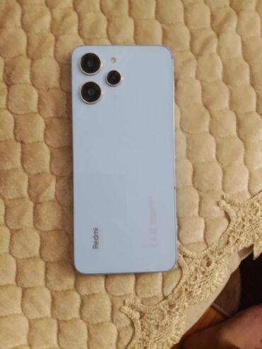islenmis soyducu: Xiaomi Redmi 12, 128 ГБ, цвет - Синий, 
 Отпечаток пальца, Face ID