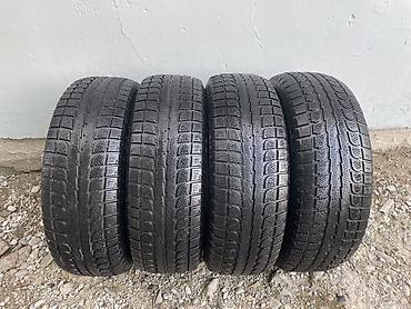 Комплект из 4 автомобильных шин. Характеристики: - Тип: зимние