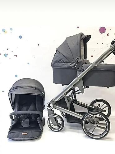 Детская коляска Skilmax 2-в-1 в универсальном черном цвете.Состояние