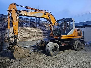 Экскаваторы: Экскаватор, Samsung, 1998 г., Колесный — 13