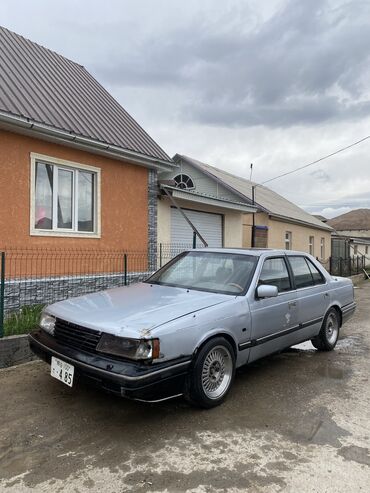 Транспорт: Mazda 929: 1988 г., 2.4 л, Механика, Бензин, Седан
