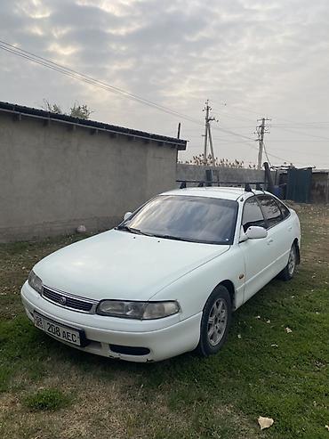 пинин ио: Mazda Cronos: 1994 г., Механика, Бензин, Седан — 1