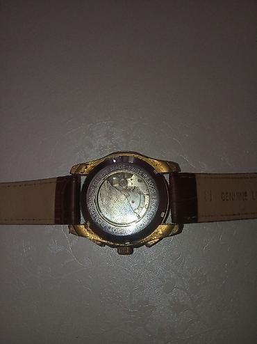 saat samdan: Tissot kişi qol saatı - Korpus: qızılı rəngli yuvarlaq metal korpus — 1