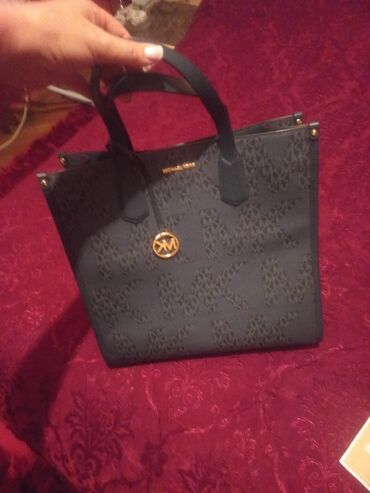 Çantalar: Əl çantası, Michael Kors
