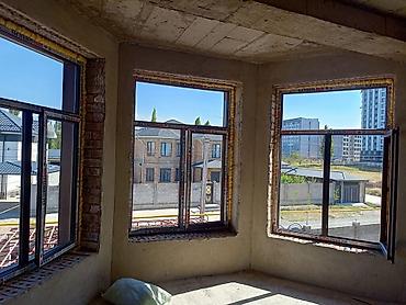 Панорамные металлопластиковые окна с поворотно-откидными створками -