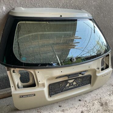 зеркало на ланкастер: Крышка багажника Subaru 2000 г., Б/у, цвет - Бежевый,Оригинал