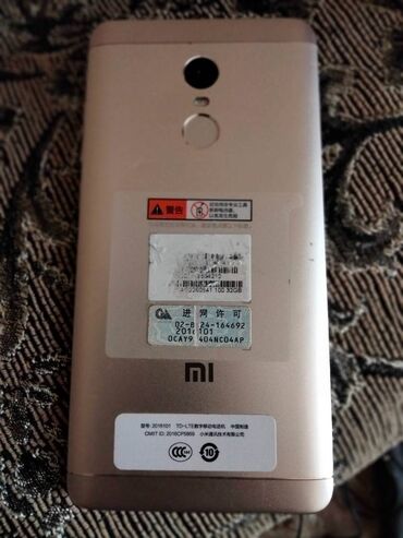 radio telefon: Xiaomi 2 GB, rəng - Qızılı, 
 Sensor, Barmaq izi, İki sim kartlı