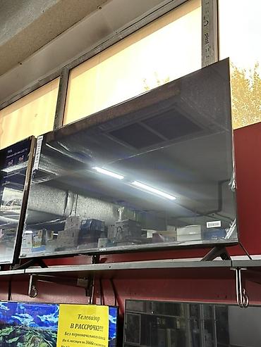 LED-телевизор VEKN, диагональ около 43–50". Особенности: - Тонкие