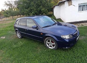 каракол мото: Mazda 323: 2003 г., 1.3 л, Механика, Бензин — 1