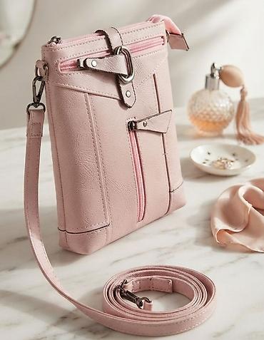 Elegantna ženska crossbody torbica u puder‑roze boji. - Materijal