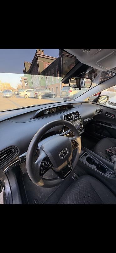 byd e2 2025: Toyota Prius: 2021 г., 1.8 л, Бензин, Лифтбек — 5