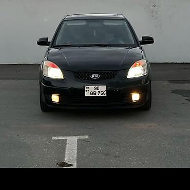 masin 099: Kia Rio: 1.4 l | 2008 il Sedan — 1
