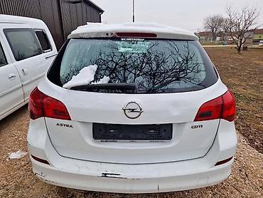 gedora za lambda sondu: GEPEK VRATA KARAVAN BELA BOJA ZA OPEL ASTRA J | Svi delovi za Opel — 1