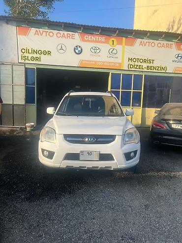 4 teker atv: Kia Sportage – ağ rəngli, şəhər və yolsuzluq üçün praktik kompakt SUV — 1