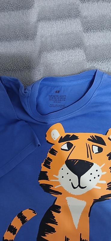 H&M brendinə məxsus uşaq футболkası. Mavi rəngdədir və ön lalafo.az -da H&M brendinə məxsus uşaq футболkası. Mavi rəngdədir və ön