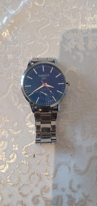 tissot 1853 saat: Tissot üslublu kişi qol saatı - Korpus və qolbaq: metal, paslanmayan — 1