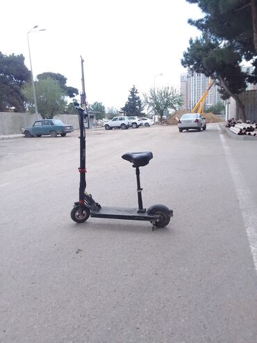 qaçış aparatı satış: Elektrik skuter – oturacaqlı model - Qara rəngli elektrik skuter -
