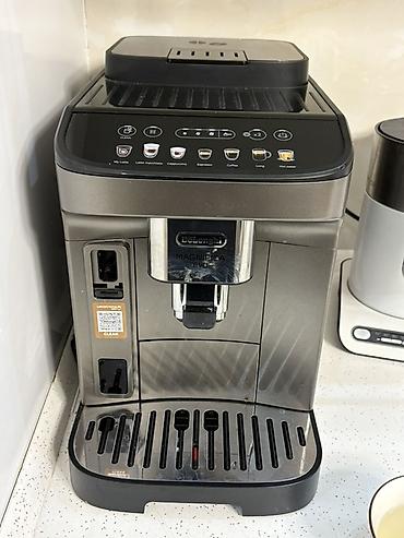 redmagic 10s pro qiymeti: DeLonghi Magnifica Evo tam avtomatik qəhvə maşını. Model üzərində — 1