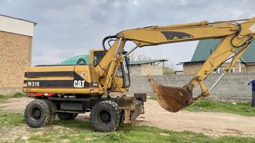 Экскаваторы: Экскаватор, Caterpillar, 2000 г., Колесный