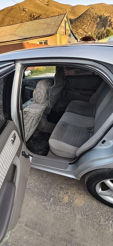 чехол на мопед: Mazda 626: 2000 г., 2 л, Механика, Бензин, Хэтчбэк — 7