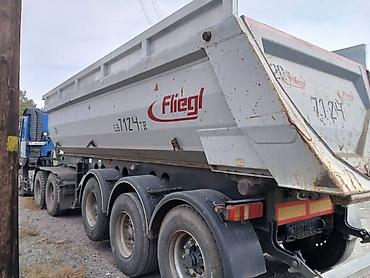 самосвали: Самосвальный полуприцеп Fliegl. Трёхосный полуприцеп для перевозки — 1