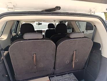 byd e6: Электромобиль (кроссовер/MPV) белого цвета с 3 рядами сидений и — 3