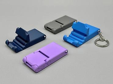 Telefon üçün tripodlar: 📱🔑 Kompakt Telefon Tutacağı + Açarliq Kiçik ölçü, böyük rahatlıq! Bu — 9