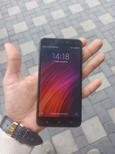 Другие мобильные телефоны: Redmi 4X, 32 ГБ, цвет - Черный, Отпечаток пальца