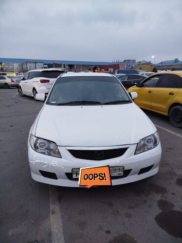 обмен на авто с доплатой: Mazda Familia: 2001 г., 1.3 л, Автомат, Бензин, Седан