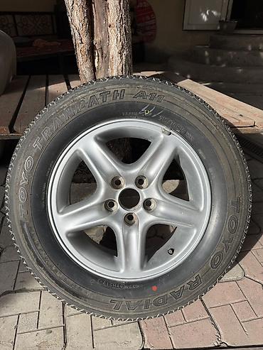 4 vd: Литой диск с шиной Toyo Tranpath A/T (A11) Для запаски на Rx 300 — 1