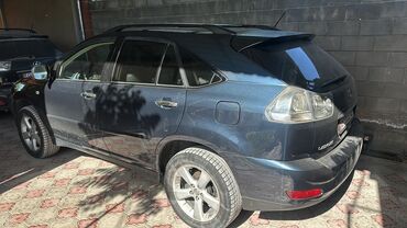 машина айнек: Автомобиль Lexus RX, выполненный в цвете "темный графит" или "черный