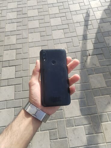 telefon fly fs451: Xiaomi Redmi 7, 64 ГБ, цвет - Черный, 
 Кнопочный, Отпечаток пальца, Face ID