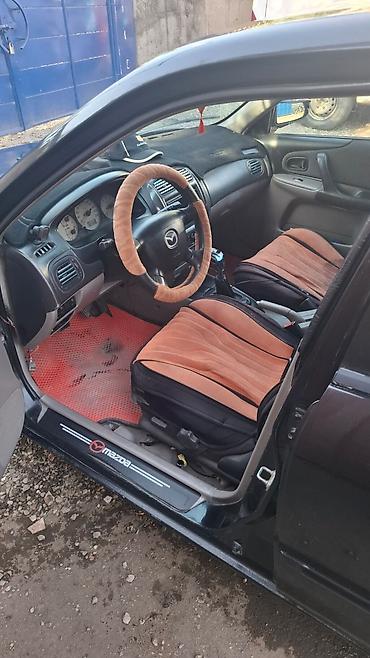 mazda 2000: Mazda 323: 2002 г., 1.6 л, Механика, Бензин, Универсал — 4