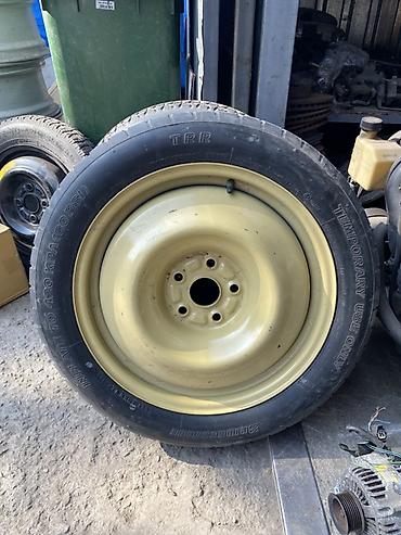 4 100 16: Запасное колесо в сборе для автомобиля: стальной диск с шиной — 1