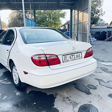 diska 13: Nissan Sunny: 2002 г., Автомат, Бензин, Седан — 8