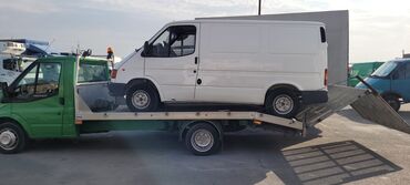 evakuator: Evakuator xidmeti minik maşınları ve diğer yüklerin rayonlara
