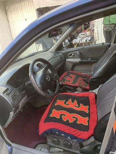 авто пульт: Mazda 323: 2002 г., 1.6 л, Механика, Бензин, Хэтчбэк — 4