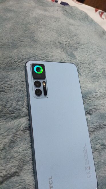 телефон fly wizard plus: TCL smartfon - Rəng: Açıq mavi arxa panel, yanlarda qara çərçivə -