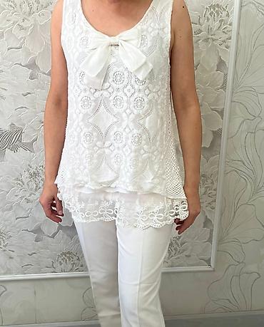 Другая женская одежда: Джинсовый комбинезон синего цвета с классическим дизайном. Модель — 29