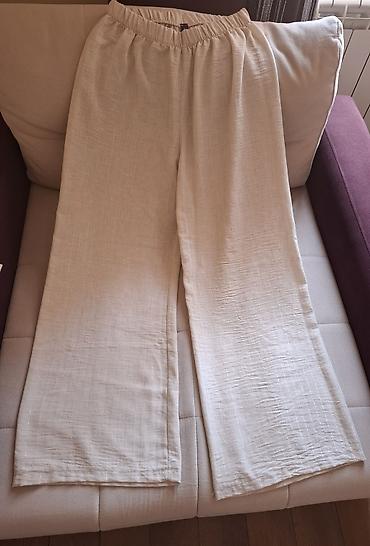 popit torbice: Ženske široke pantalone u svetloj, krem-bež nijansi, sa opuštenim i — 1