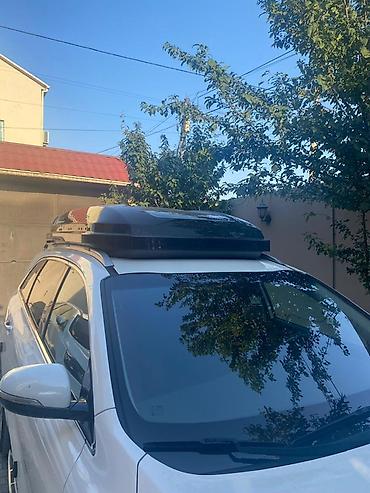 baqaj dam: Avtomobil üçün dam üstü baqaj qutusu (roof box). Aerodinamik formalı — 6