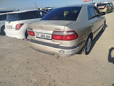 бу тачила: Mazda Capella: 1998 г., 1.8 л, Механика, Бензин, Седан — 4