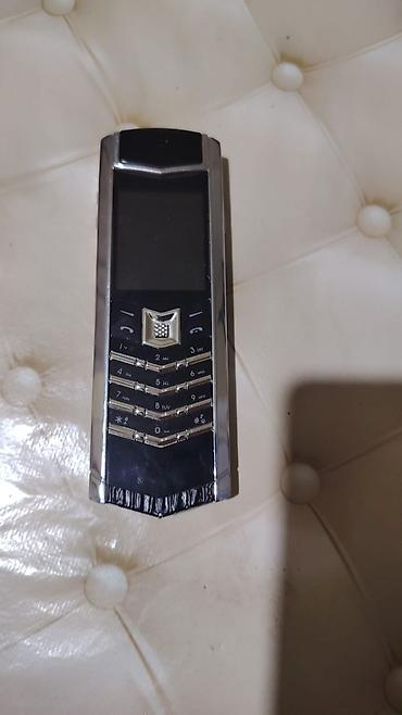 Техника и электроника: Vertu < 2 ГБ, цвет - Черный, Кнопочный — 1