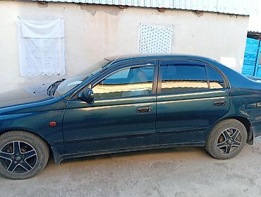 тунуке бу: Toyota Carina E: 1995 г., 1.6 л, Кол менен иштөөчү, Бензин, Седан — 5