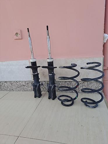 ses ucaldan: Avtomobil üçün ön asqı komplekti Tərkibi: - 2 ədəd ön amortizator — 1
